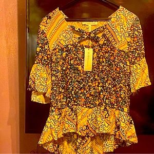 Cute multi colored BCBG top. With tag still on never worn.